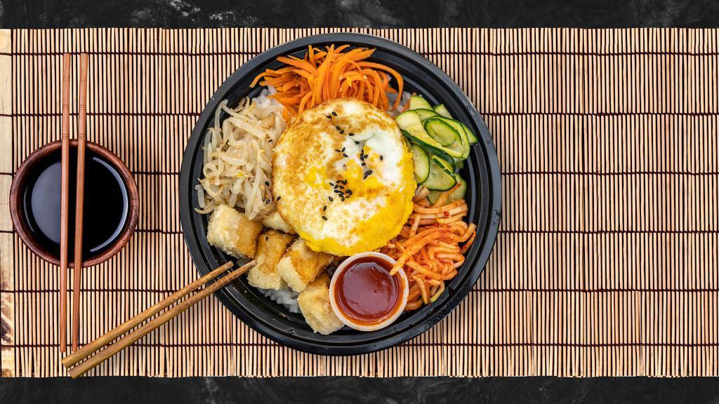 Vegan Club Bibimbap · Fresh carrots, zucchini, bean sprouts, and radish with crispy tofu piled on fresh white rice, topped with a special spicy gochujang sauce.