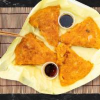 Kimchi Pancake · House made dough with kimchi pan fried to flaky and delicious perfection!