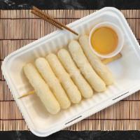 On The House Duk Kko Chi · Delicious homemade rice cakes, skewered, and fried to perfection. Served with house made dip...
