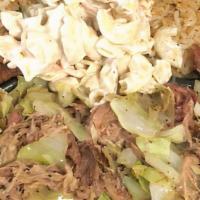 Kalua Pork & Cabbage · Hawaiian-style pork smoked in mesquite wood with cabbage.