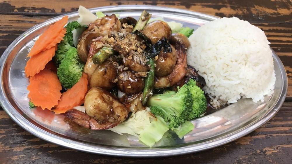 Garlic And Pepper · Choice of meat stir fried with mushrooms, green onions and bedded with steamed carrots and broccoli. Served with choice of rice.