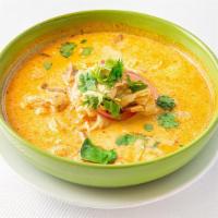 Tom Kha Soup · Lemongrass, galangal, tomato, mushroom, onions, coconut milk, and protein. Medium spicy.
