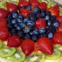 9 Inch Fruit Tart · Strawberrys, blueberry, kiwi, and blackberry on top of homemade vanilla custard