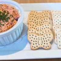 Smoked Wild Salmon Rillettes · A spread with red onions, capers, housemade mayonnaise, chives, and assorted crackers. Crudi...