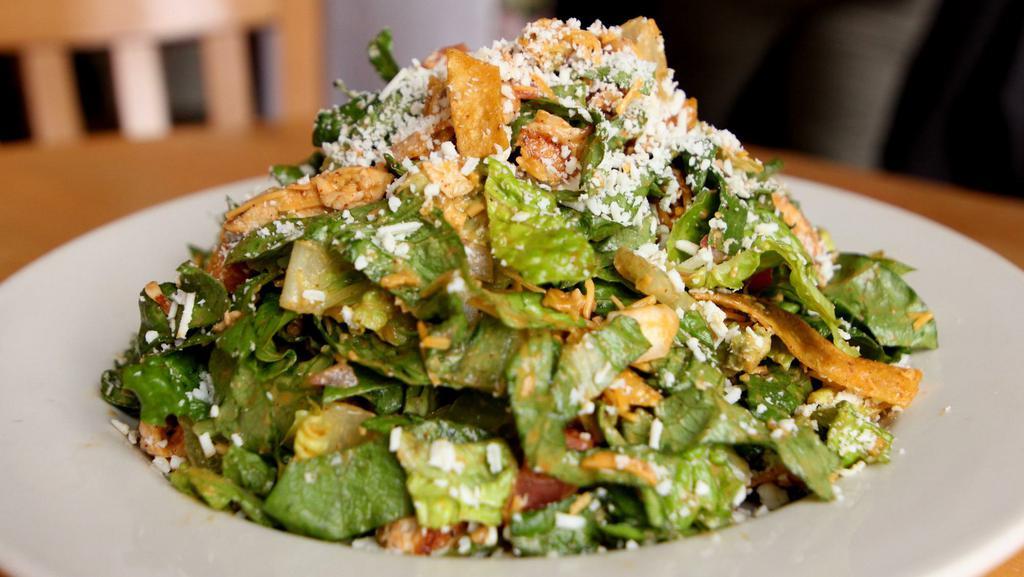 Mexican Chopped Salad · Marinated grilled chicken breast, tomato, red onion, avocado, cheddar, crispy tortilla strips, romaine, honey-lime vinaigrette, cotija cheese