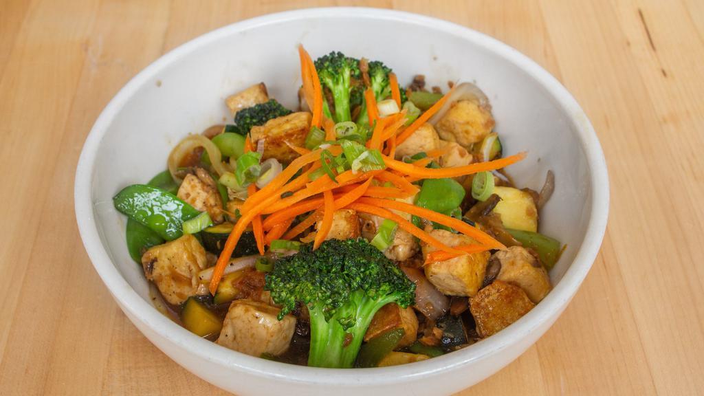 Tofu Stir-Fry · Onions, peppers, mushrooms, broccoli, zucchini, snow peas, carrots, green onions, choice of soy-ginger or coconut green curry.