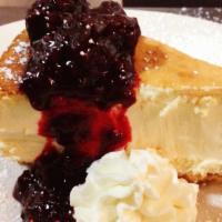 Cheesecake Of The Moment · Varying kinds of cheesecake, toppings and sauces.  Changes daily. Item pictured is an exampl...