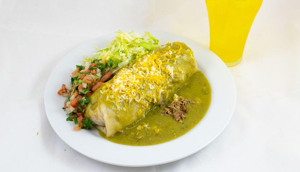 Smothered Burrito · Smothered with Chile Verde(Green Salsa), topped with Cheese, filled with Chile Verde Diced Pork, Rice, Beans with side of Pico de Gallo & Lettuce plus a Medium Soda!