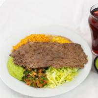 Carne Asada Plate · Two Sliced Steak, Guacamole, Lettuce, Pico de Gallo, Rice & Beans with Tortillas.