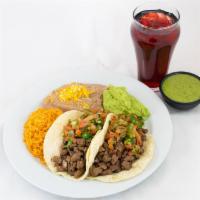 Two Carne Asada Tacos · Two Corn Tortillas served with Diced Steak, Guac, Pico de Gallo, side of Rice & Beans.
