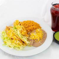 Two Tacos · Your choice Shredded Beef/ Chicken or Fried Fish. Also served with Rice & Beans.

*Shredded ...