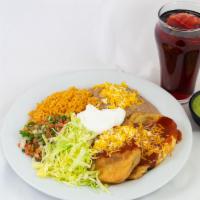Chiles Rellenos · Two Chiles Rellenos, topped with Red Sauce, Guac. Sour Cream, Pico de Gallo, Lettuce, side o...