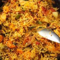 Vegetable Biryani · Vegetable Biryani is a dish of rice mixed with vegetables that has been cooked in an onion a...