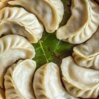 Full Plate Momo · Eight pieces. Four pieces. Dumpling is a broad class of dishes that consist of pieces of dou...