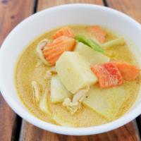 Yellow Curry · Yellow curry with coconut milk, potatoes, bell pepper, carrot and onions served with rice.
