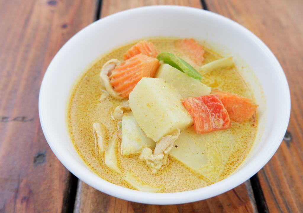 Yellow Curry · Yellow curry with coconut milk, potatoes, bell pepper, carrot and onions served with rice.