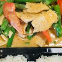 Pa Nang Curry · PA nang curry with coconut milk, green beans, bell peppers, and basil leaves served with rice.