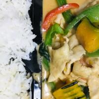 Pumpkin Curry · Red curry with coconut milk, pumpkin, bell peppers, and basil leaves served with rice.