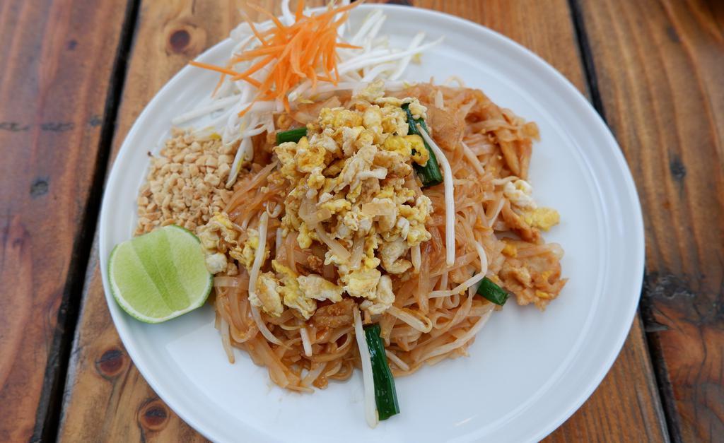 Pad Thai · Thai rice noodles stir fried with egg, bean sprouts, green onions, and ground peanut.