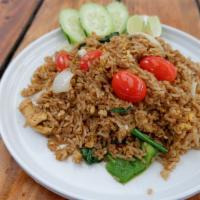 Spicy Sweet Basil Fried Rice · Fried rice with egg, fresh ground chili, onions, tomatoes, bell pepper, and basil.