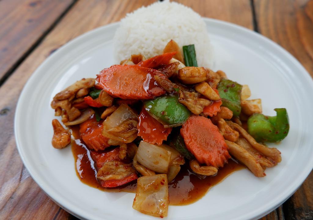 Cashew Nut Stir Fried · Stir fried onions, cashew nuts, carrot, bell peppers, and chili paste served with rice.