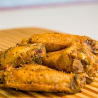 Lemon Pepper Wings · Ten wings tossed in house-made sauce. Served with your choice of dipping sauce.