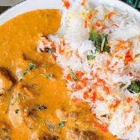 Butter Chicken · Creamy, buttery masala slowly simmered with onions, garlic, and spices.
