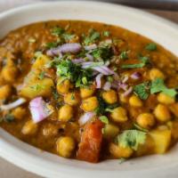 Chole Masala · Stewed chickpeas and potatoes in our house curry sauce with spices.