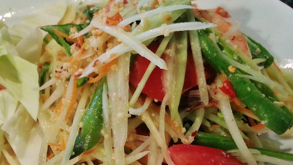 Som Tum Salad · Shredded papaya with prawns, tomatoes and crushed peanuts tossed in a chili-lime vinaigrette.