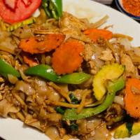 Pad Kee Mao · Stir-fried wide rice noodles with meat, egg, assorted vegetable and sweet basil leaves.