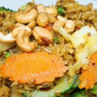 Curry Fried Rice · Jasmine rice stir-fried with meat, diced pineapple, onion, carrots, egg and cashews with a t...