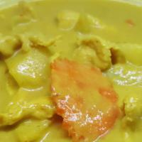 Yellow Curried · Mild yellow curry paste in coconut milk with meat, potatoes, carrot and onion.
