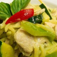 Green Curried · Green curry paste in coconut milk with meat, bamboo shoots, zucchini, bell pepper and sweet ...