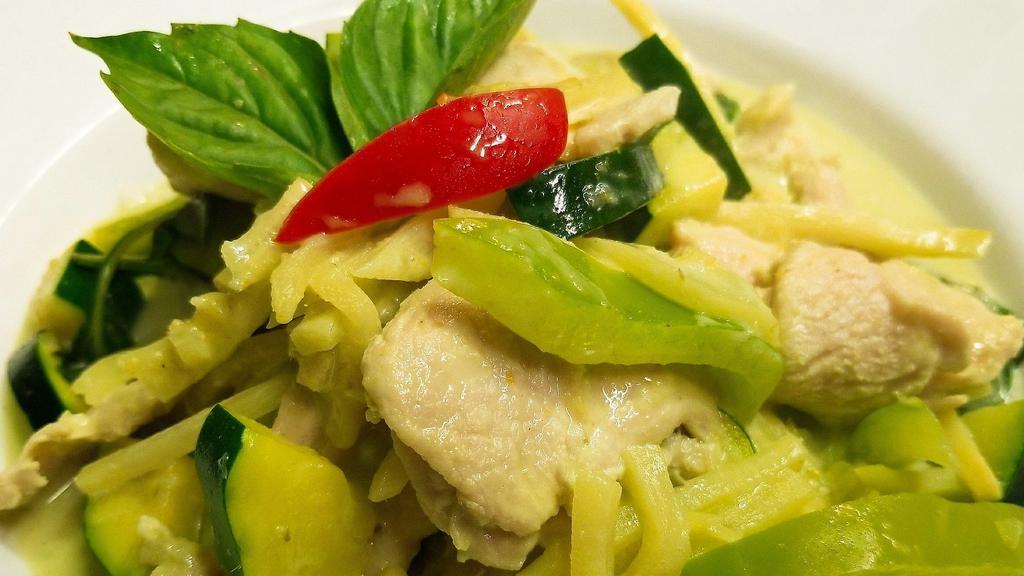 Green Curried · Green curry paste in coconut milk with meat, bamboo shoots, zucchini, bell pepper and sweet basil leaves.