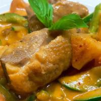 Roast Duck Curry · An exotic flavored Tender duck meat in red curry, with bell pepper tomato, zucchini, pineapp...