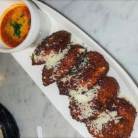 Fried Mozzarella · House-made Mozzarella, breaded and lightly fried to a golden perfection served with our rich...