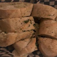 Garlic Bread · Local pearl bakery baguette baked with fresh herb, and garlic butter.