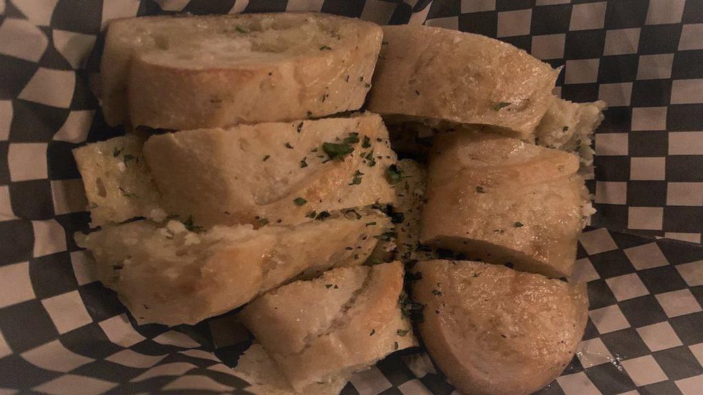Garlic Bread · Local pearl bakery baguette baked with fresh herb, and garlic butter.