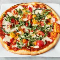 Margherita Pizza · Thin crust topped with tomato basil sauce, fresh house-made Mozzarella cheese, and fresh bas...