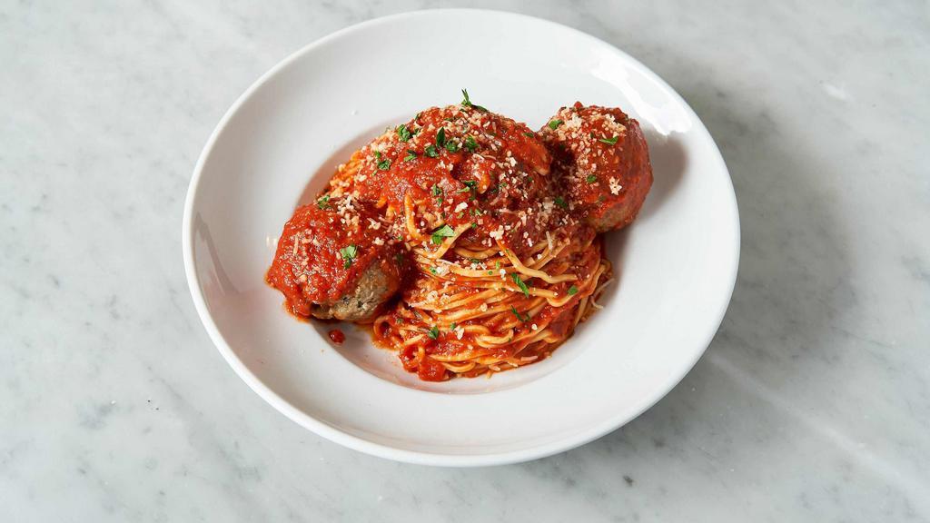 Spaghetti & Meatballs · Spaghetti pasta tossed with our pomodoro sauce and topped with half pound of our house made meatballs.