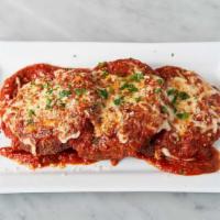 Eggplant Parmesan · Breaded and pan-fried eggplant, layered with fresh Mozzarella cheese and plum tomato-basil s...