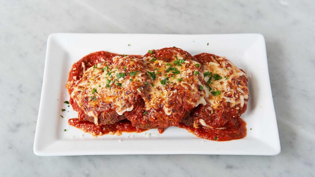Eggplant Parmesan · Breaded and pan-fried eggplant, layered with fresh Mozzarella cheese and plum tomato-basil sauce.