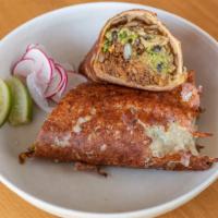 Birria Burrito Acobijado · Birria burrito stuffed with beans, rice, onions, cilantro wrapped in griddled cheese.