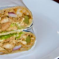 Chicken Burrito · Chicken shawarma wrapped in a flour tortilla filled with french fries,tomatoes, cucumbers, l...
