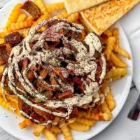 Gyro Fries With Pita Bread · French fries topped with beef & lamb gyro,garlic sauce and feta cheese.Served with pita bread.