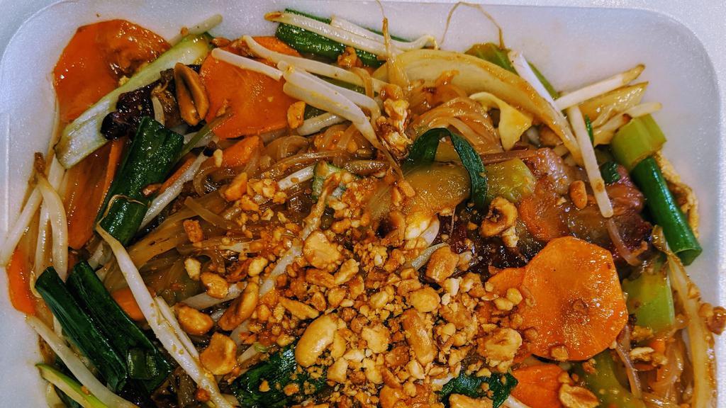 Pad Thai · Fresh rice noodle woked tossed with choice of protein, scrambled egg, yellow onion, celery, carrots, green onion, and bean sprouts in a house special padthai sauce topped with crushed peanuts and lime