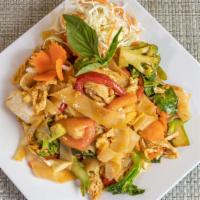 Drunken Noodle Dinner · Spicy. Wide rice noodles with egg, basil, red pepper, onion, tomato, carrot, Chinese broccol...