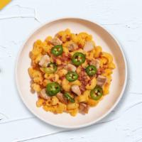 Ranch City Mac · Premium chicken, bacon, cooked in a creamy cheese sauce and topped with jalapenos to give a ...
