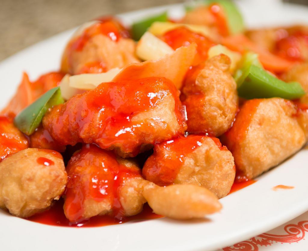 Sweet & Sour Chicken · Deep fried breaded chicken with onion, bell pepper, carrot and pineapple in sweet and sour sauce.