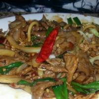Mongolian Beef · Hot and spicy. Tender beef sautéed with scallion and onion in seasoned sauce with hot pepper.